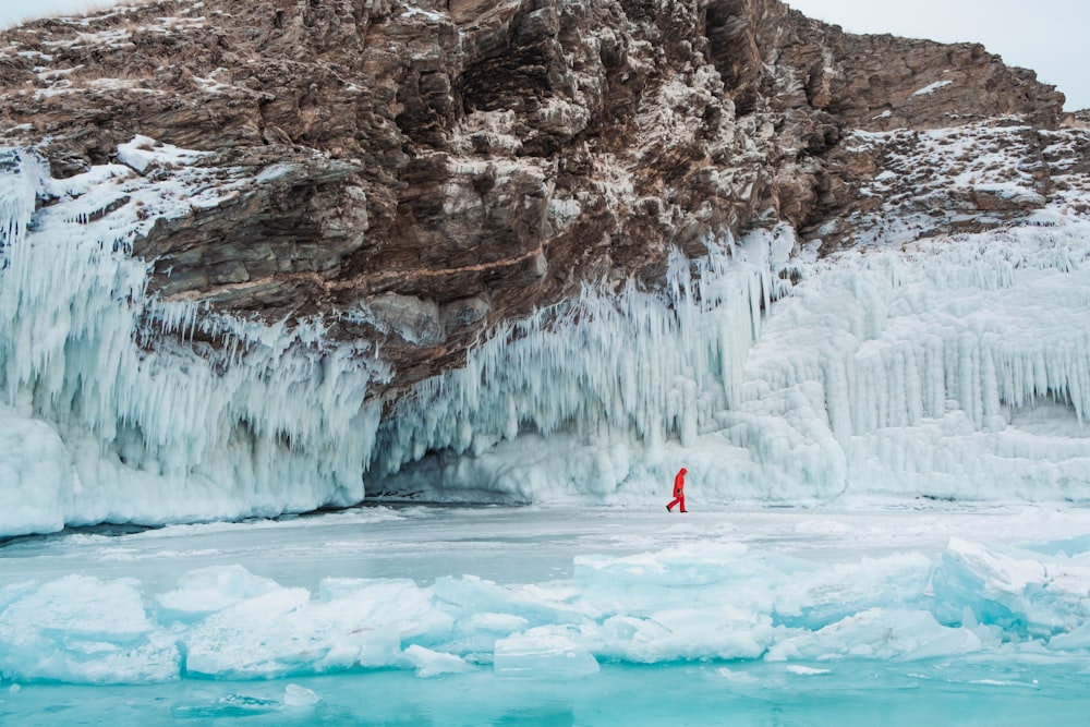 a person standing in the middle of a frozen lake