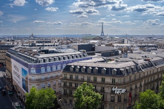 A cityscape showing European landmarks under a clear sky.