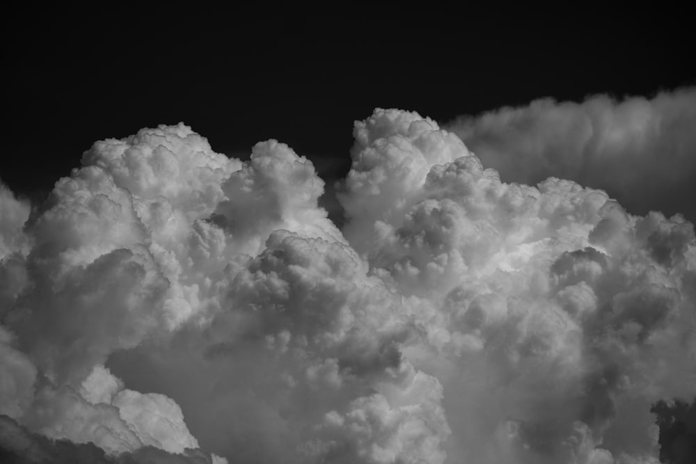 a black and white photo of clouds in the sky