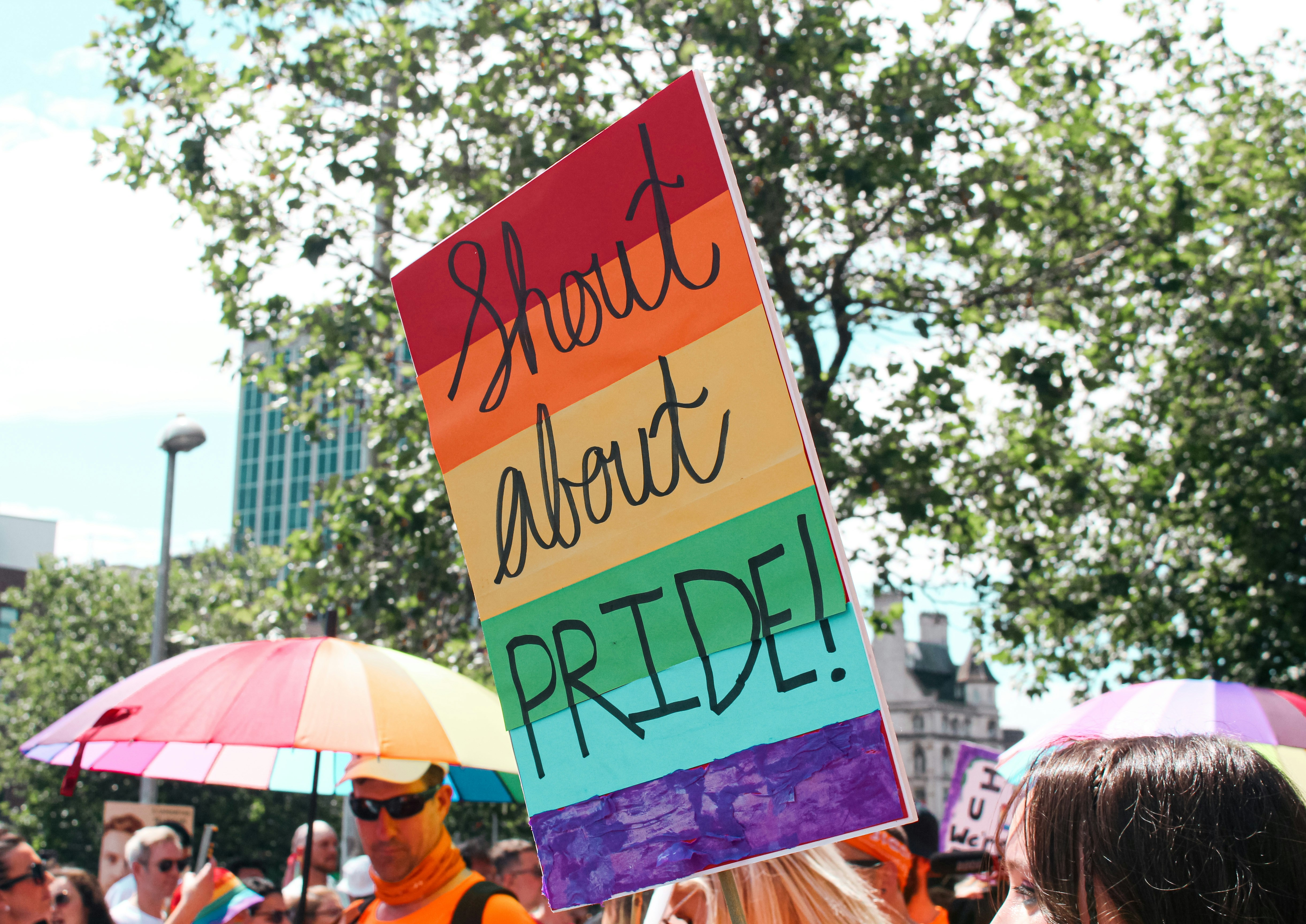 a group of people holding up a sign
