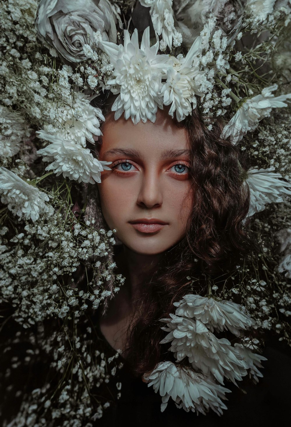 a woman with flowers in her hair