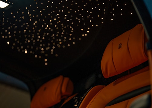 the interior of a car with a star ceiling