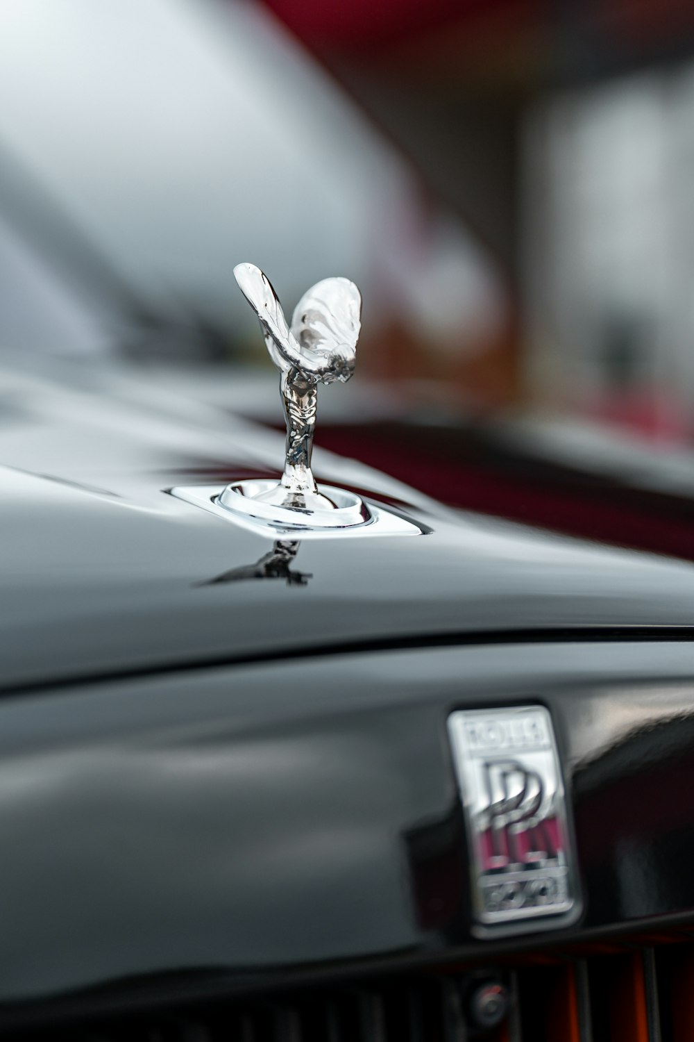 a close up of the hood ornament on a black car