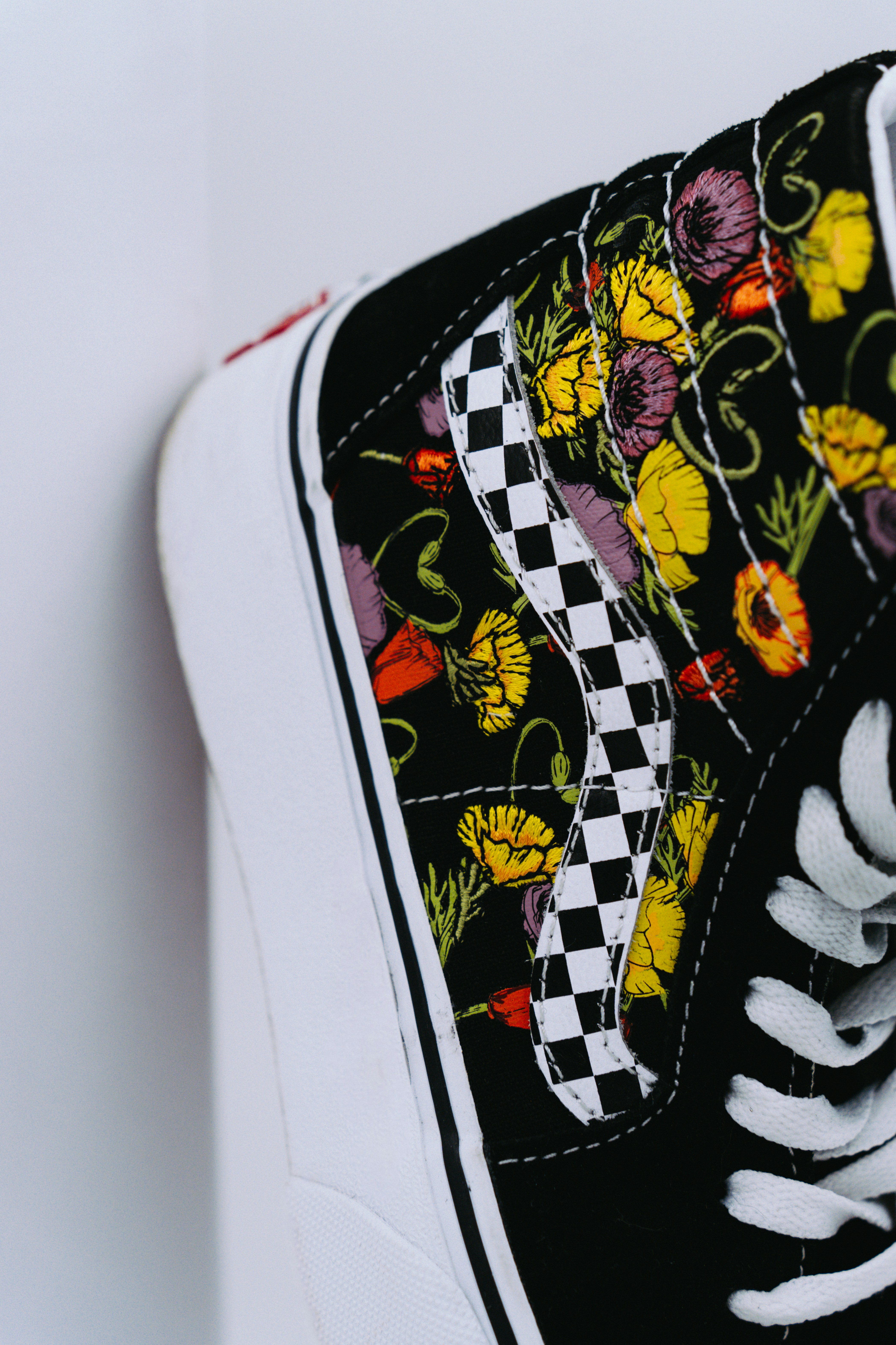 A pair of black and white shoes with flowers on them photo – Free Woman ...