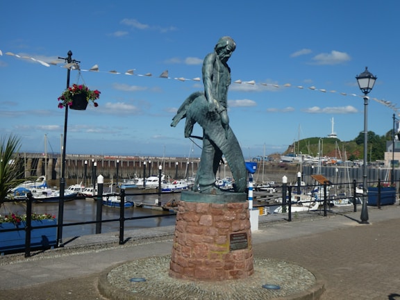 A gleaming trophy marlin caught at sunrise with the captain's proud smile.