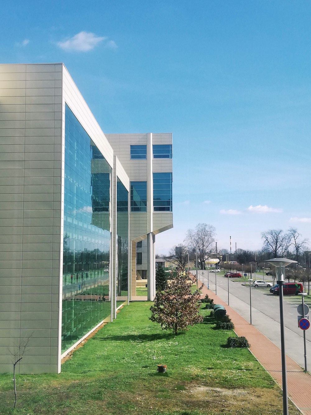 a building with a grassy lawn in front of it