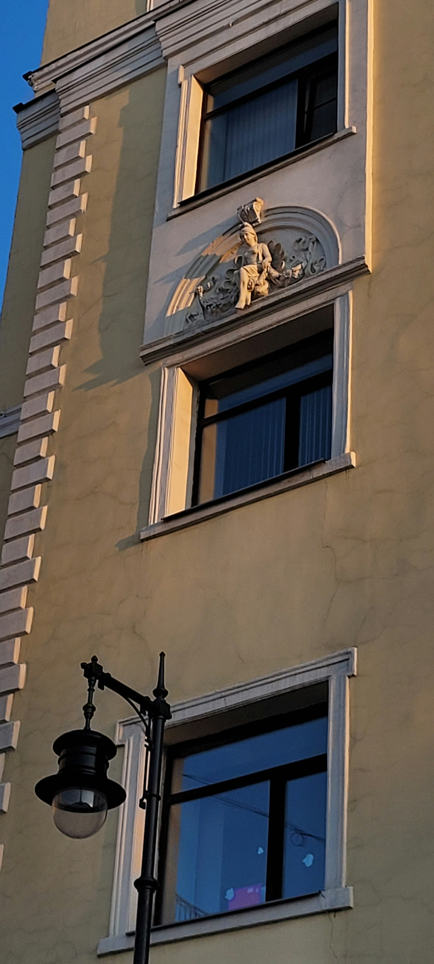 a tall building with a clock on the side of it