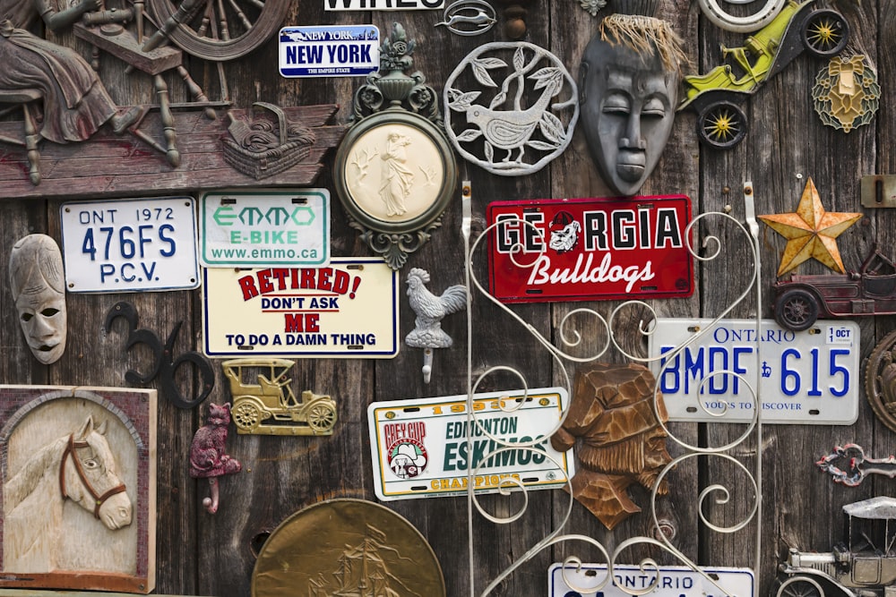 a wall covered in lots of different types of signs