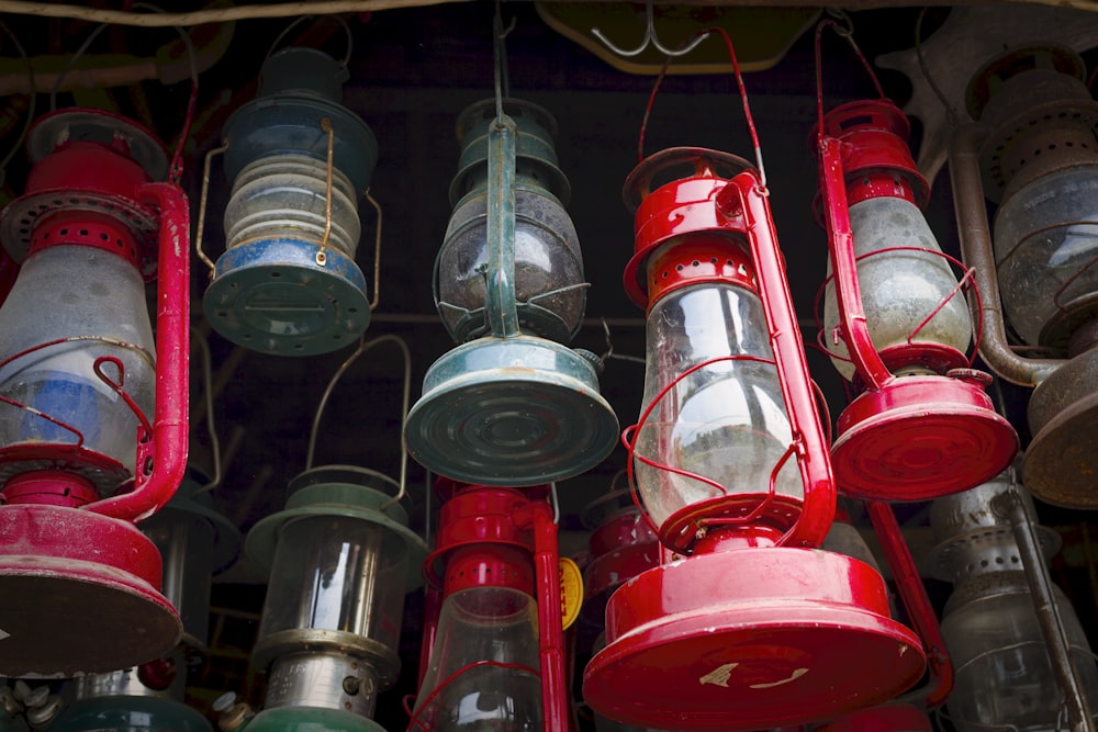 a bunch of red and green lights hanging from a ceiling