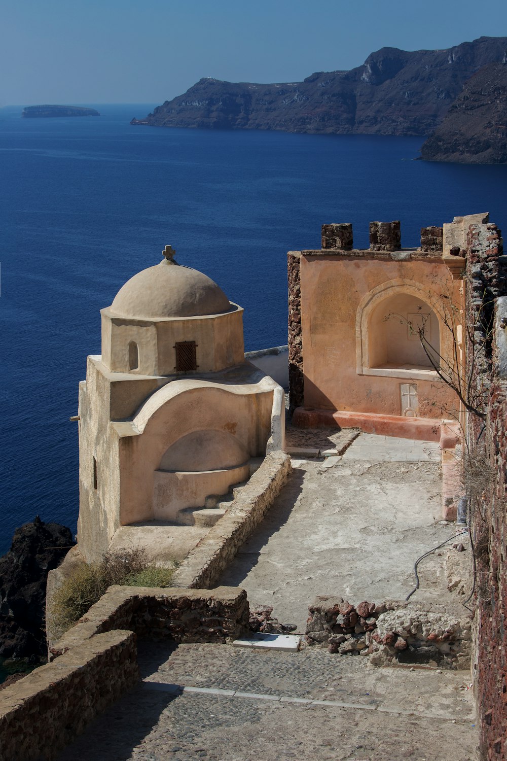 a stone building with a dome on top of it