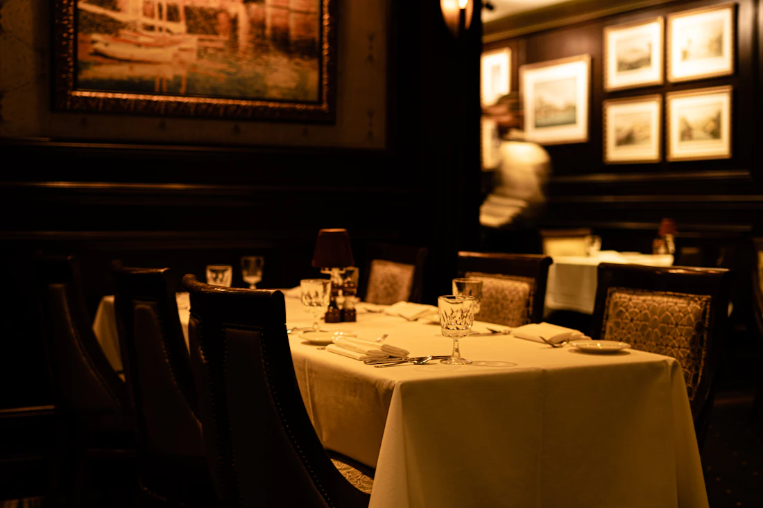 An elegant candlelit fine-dining restaurant interior