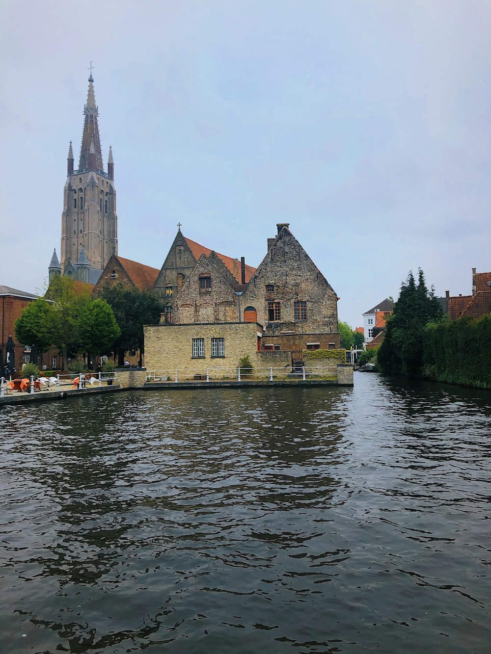 a large building sitting on the side of a river