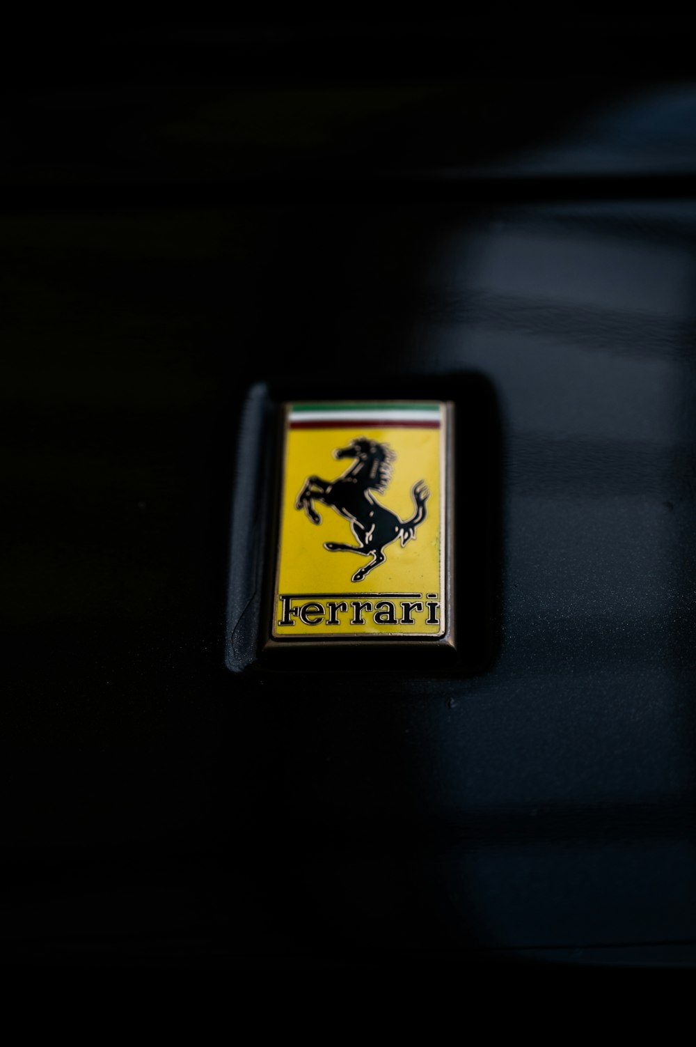 a close up of a ferrari emblem on a car
