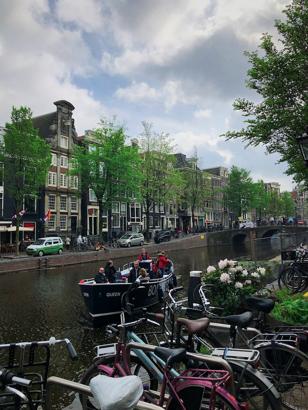 a group of bikes parked next to each other near a river