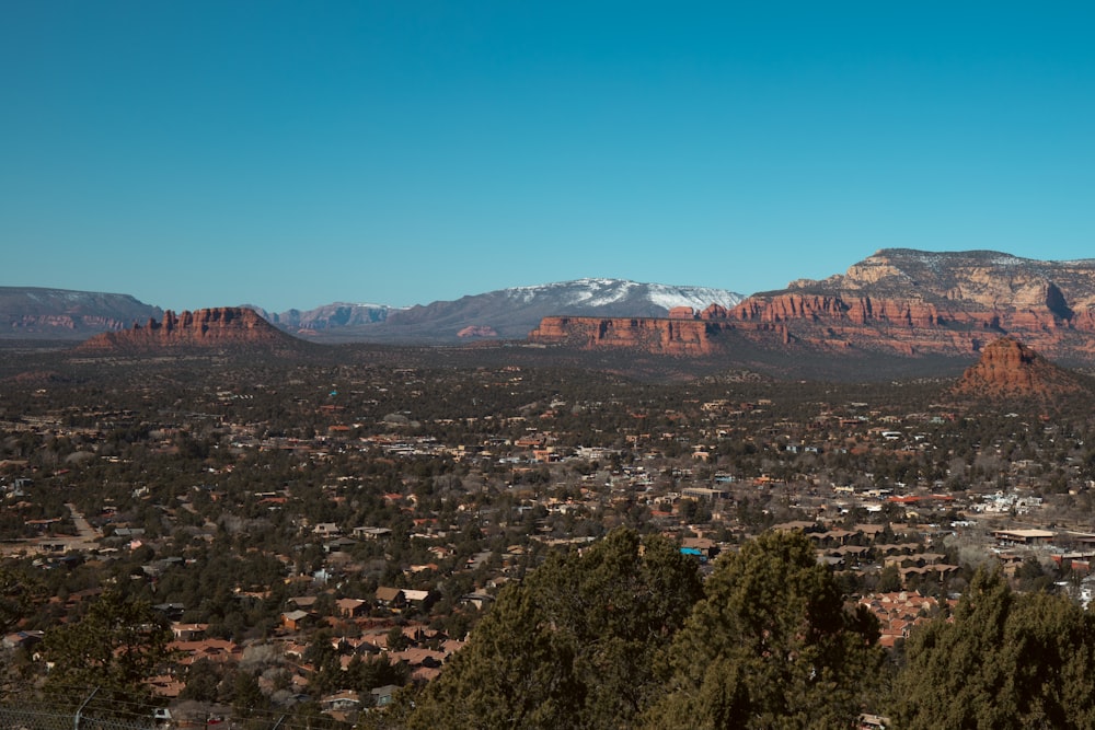 a view of a city with mountains in the background