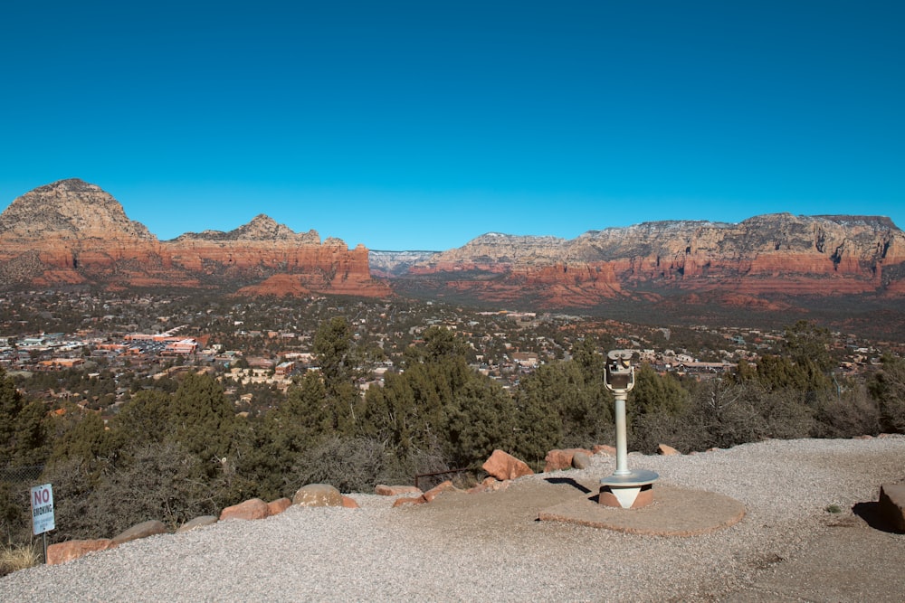 a view of a valley and mountains from the top of a hill