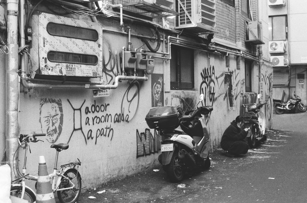 a group of motorcycles parked next to a building