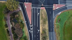 an aerial view of a street intersection with two lanes