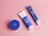 Flat lay of skincare products arranged neatly on a pastel background with soft lighting.