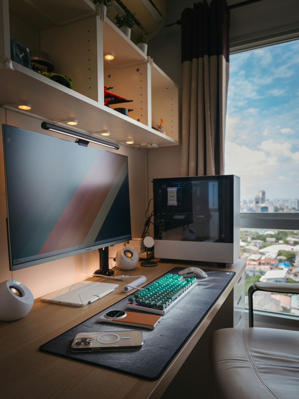 a desk with a monitor, keyboard and mouse