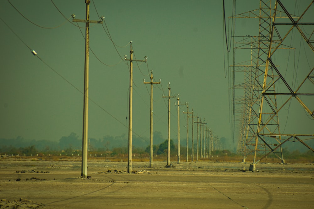 a row of telephone poles sitting next to each other