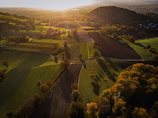 Sunset over a patchwork of agricultural plots, highlighting the diversity of crops studied.