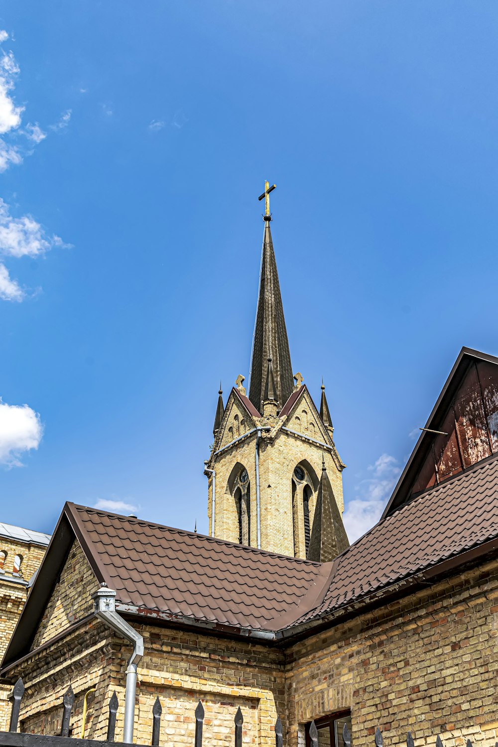 a church with a steeple and a cross on top