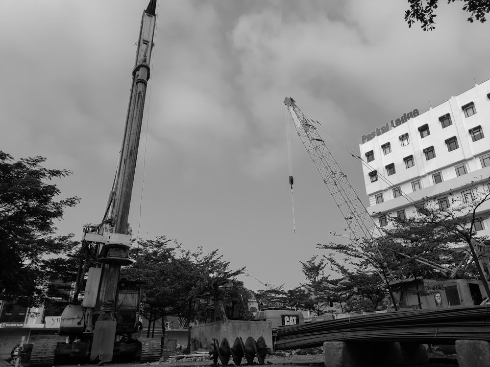 a crane that is standing in the dirt