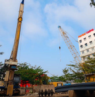 a crane that is standing next to a building