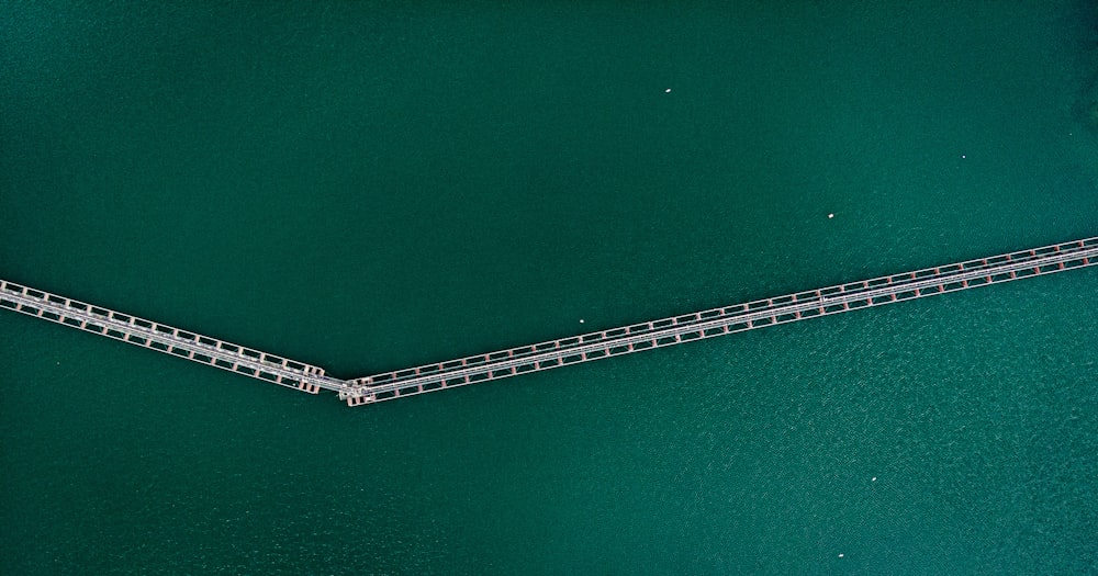 an aerial view of a bridge over a body of water