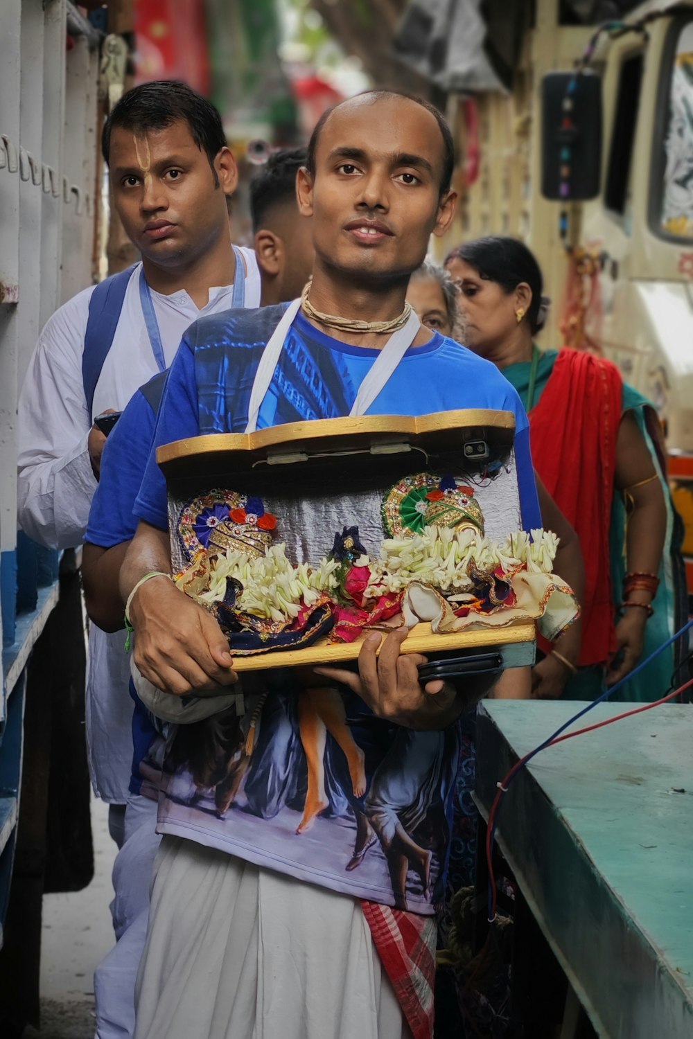 a man holding a tray of food in his hands