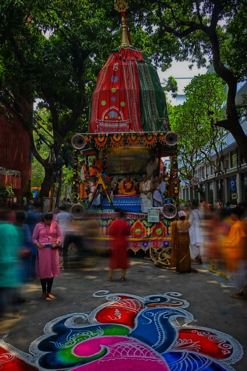 a group of people walking down a street next to a float