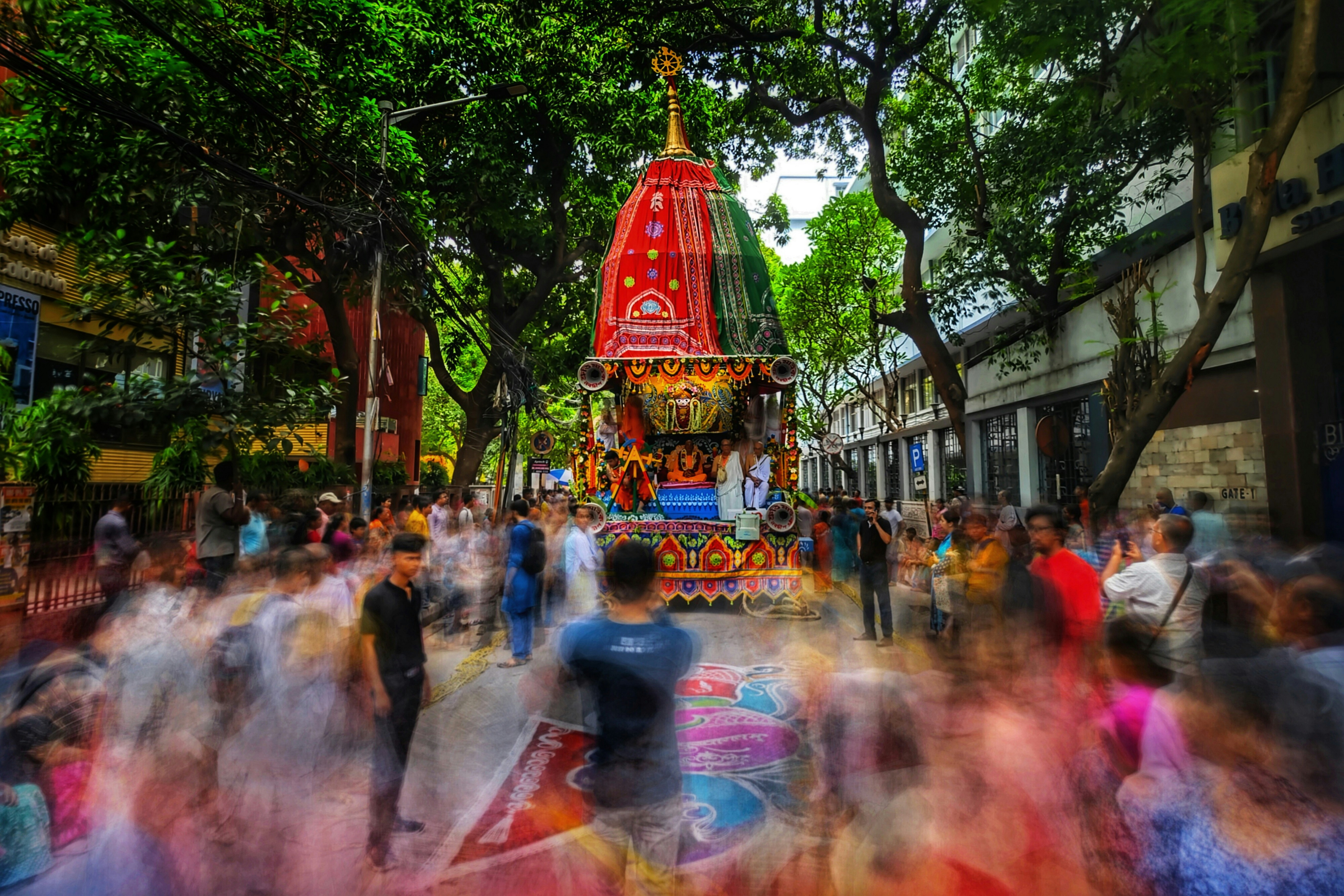 a crowd of people walking down a street