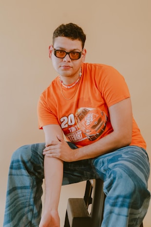 Profile card photo placeholder showing a team member in racing gear with an orange highlight border.