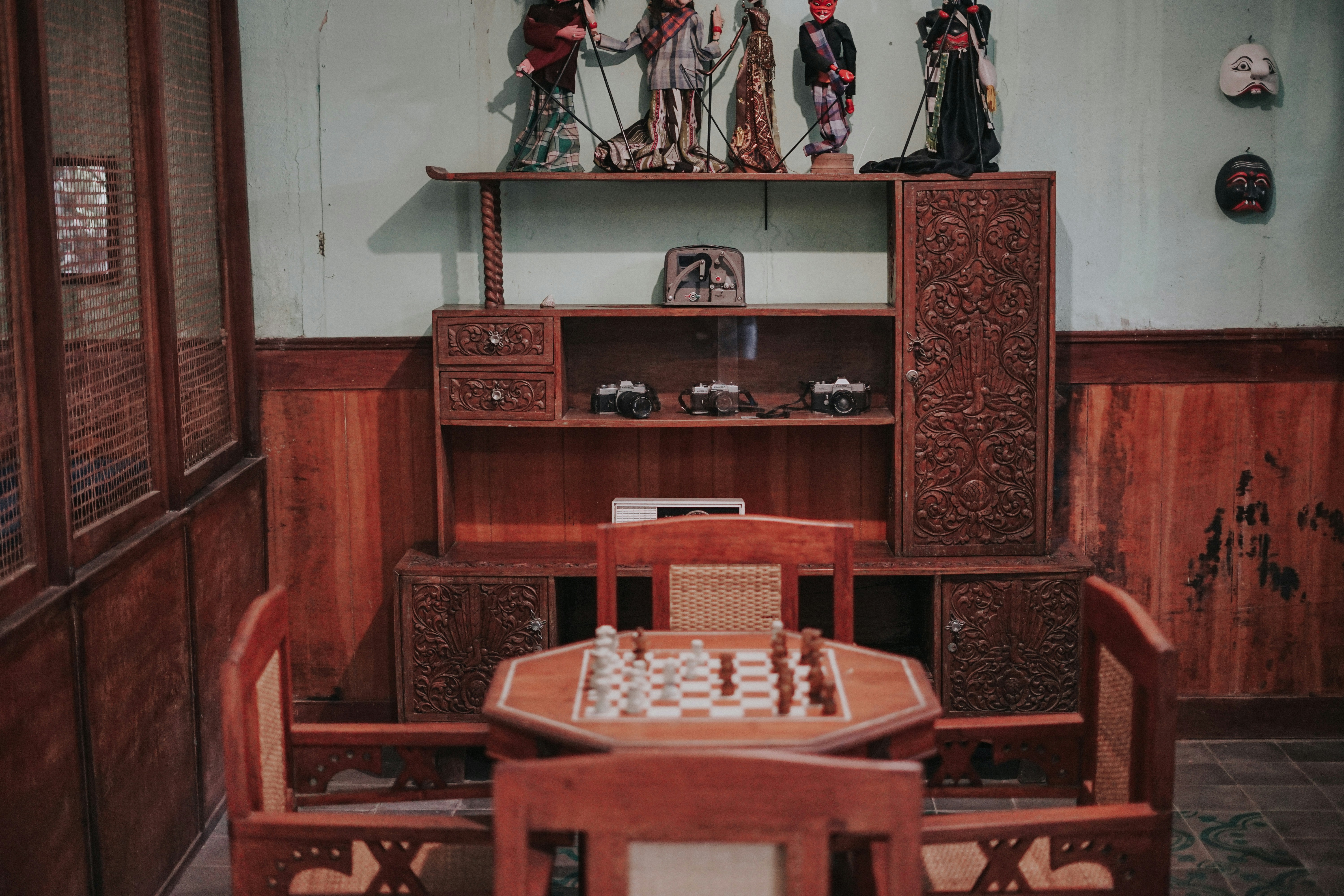 a wooden table with chess pieces on top of it