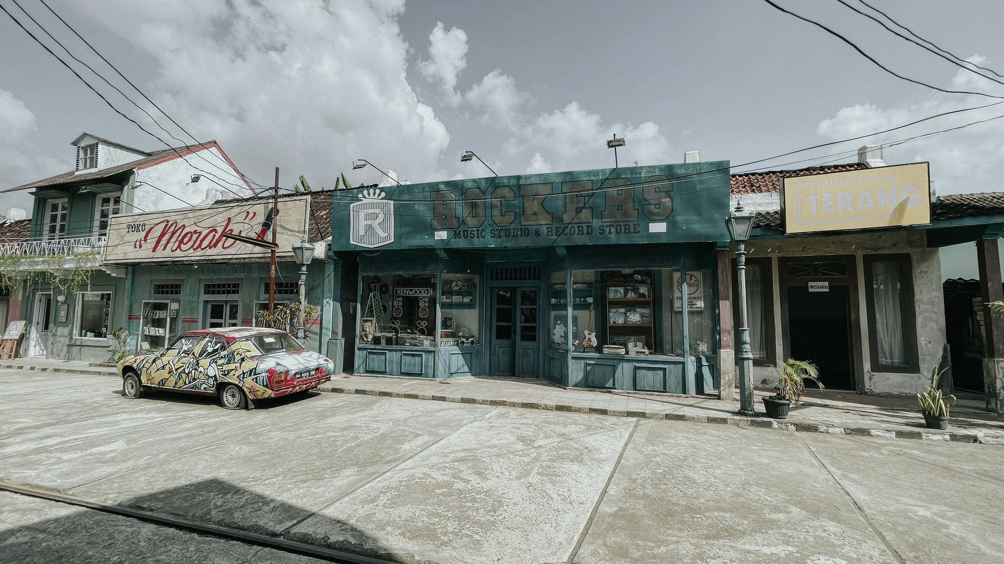 a small car parked in front of a store