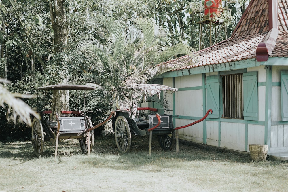 a horse drawn carriage parked in front of a house