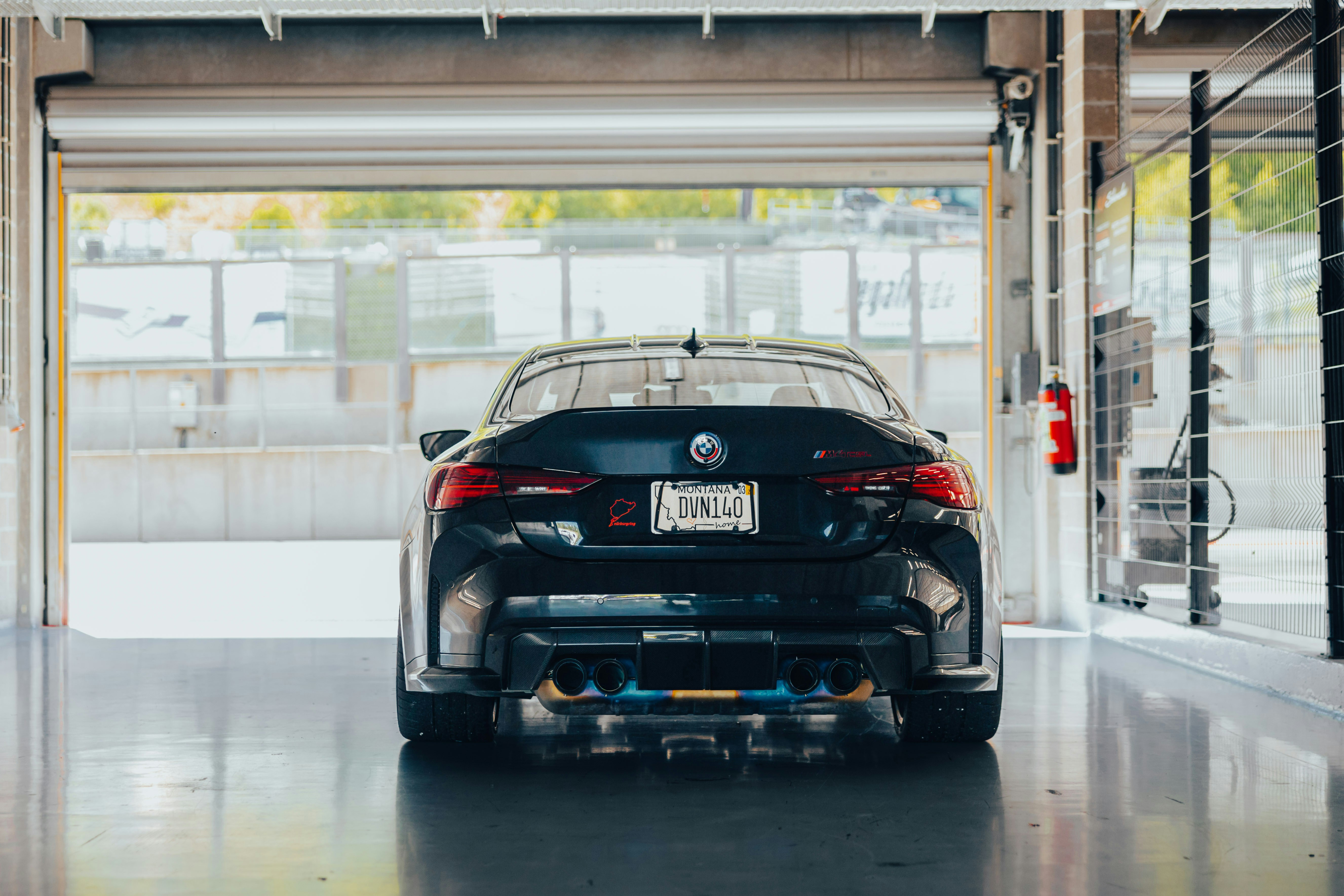 A black bmw car parked in a garage photo – Free Car Image on Unsplash