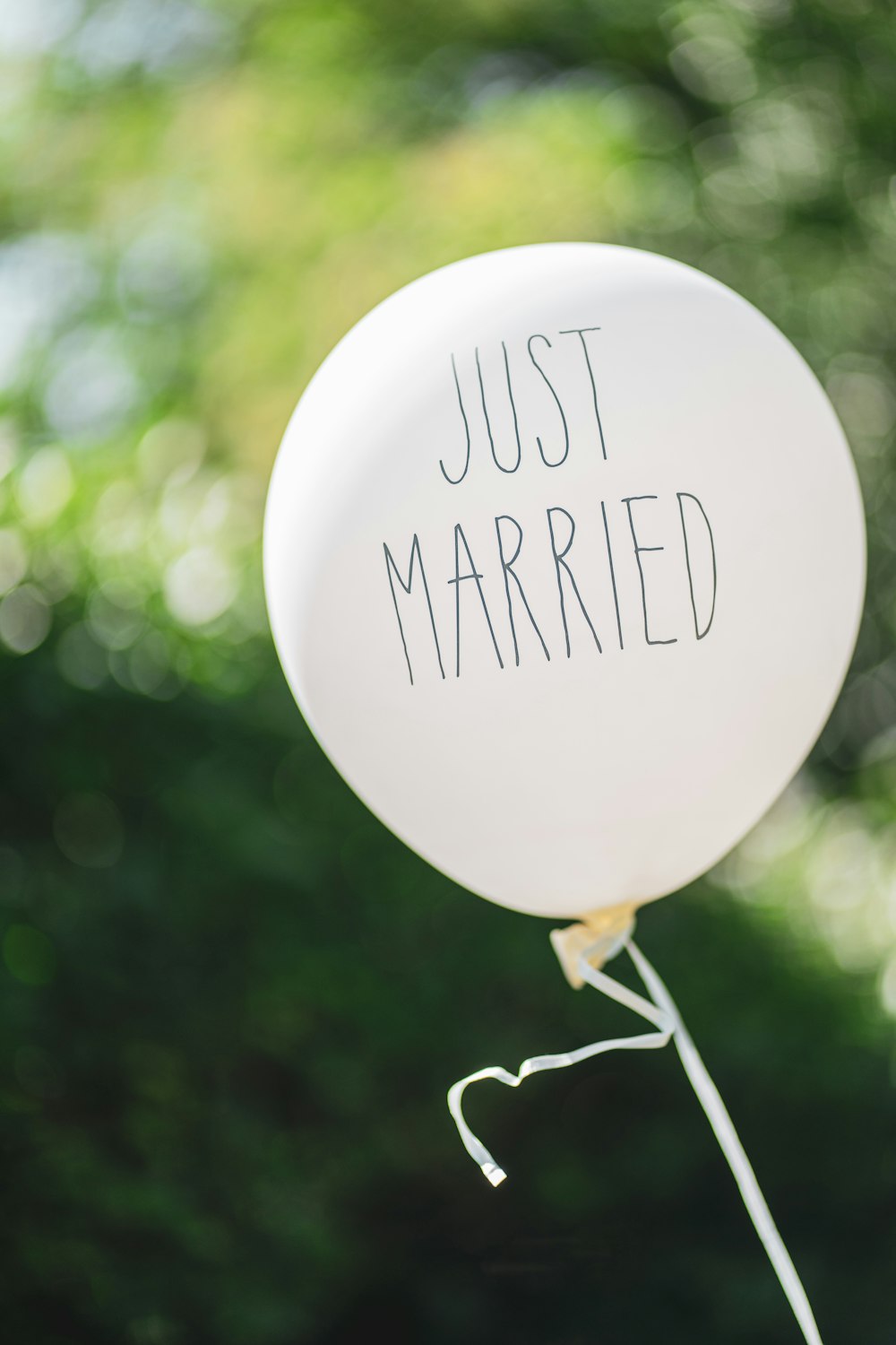 a white balloon with the words just married written on it