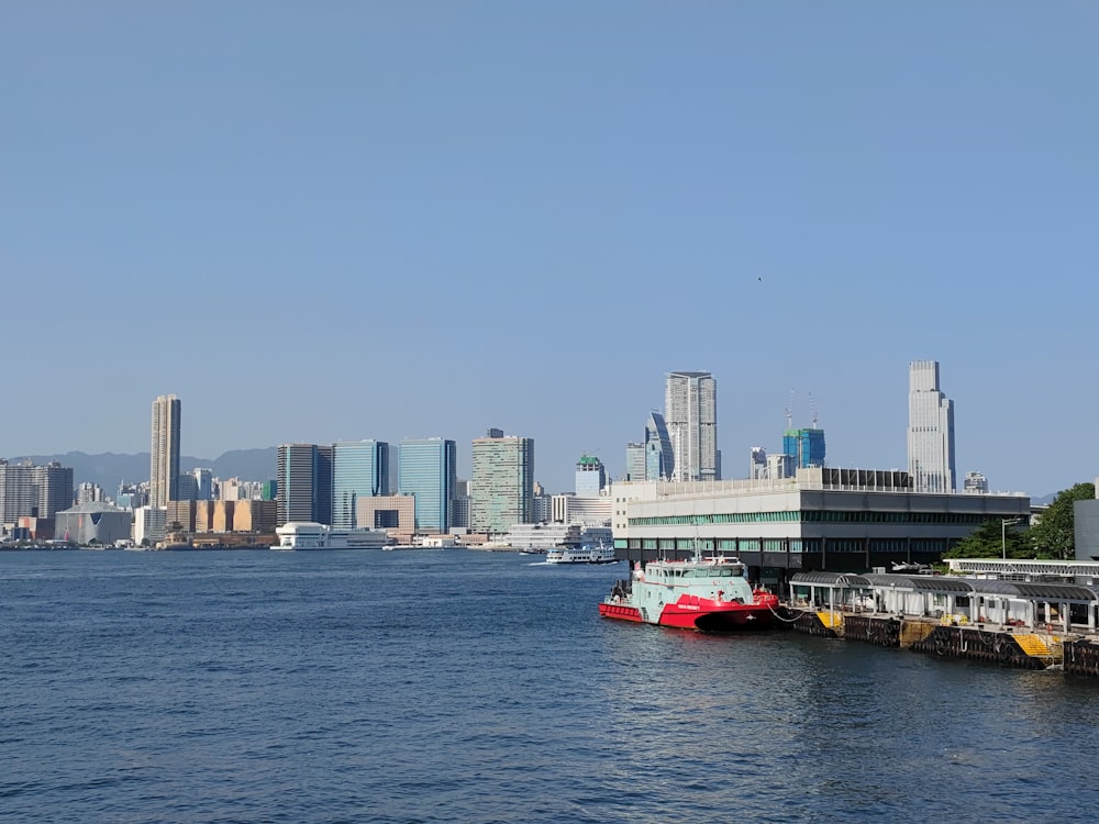 a large body of water with a city in the background