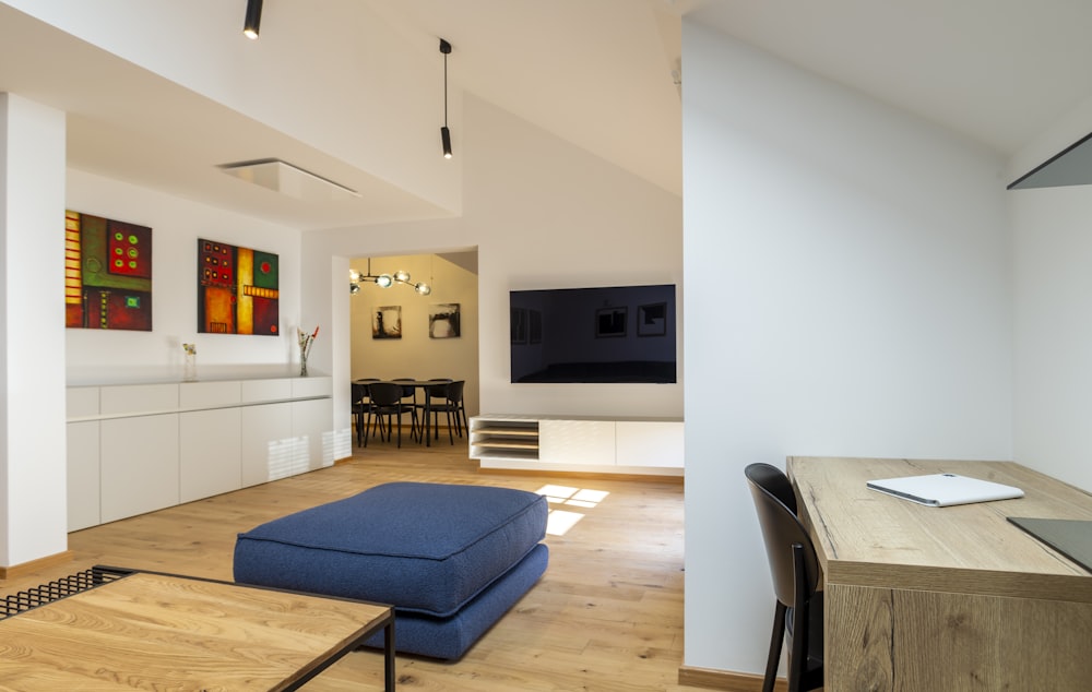 a living room with a couch a table and a tv