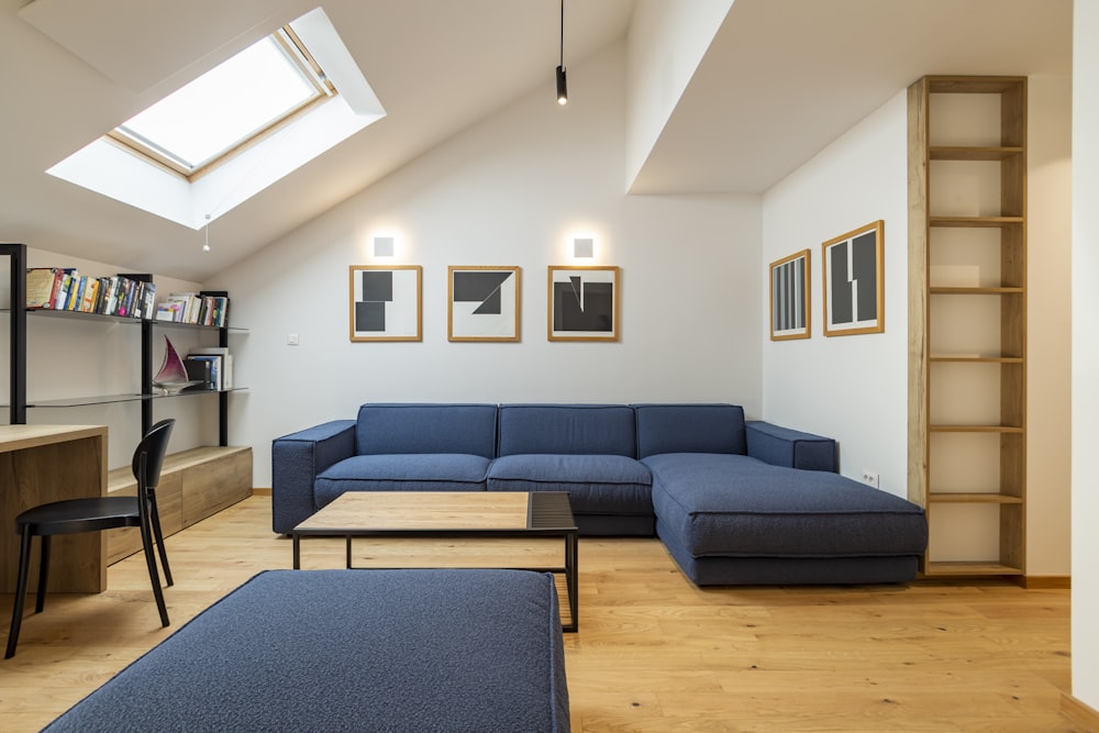 a living room filled with furniture and a skylight