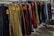 A display of colorful and trendy women's bottoms hanging on a rack in a boutique.