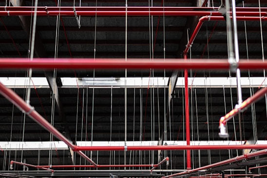 A detailed close-up of seismic pipe hangers and support materials arranged in an industrial setting.