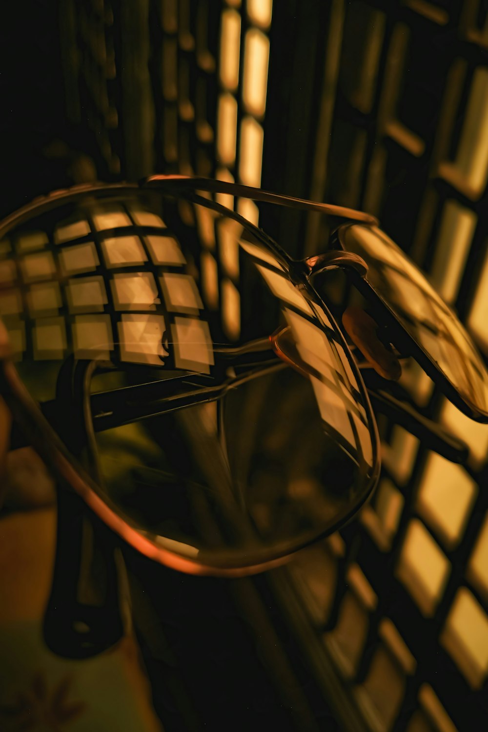 a pair of glasses sitting on top of a table