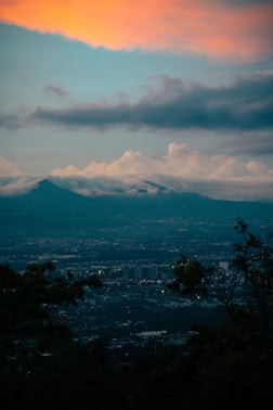 a view of a city with a mountain in the background