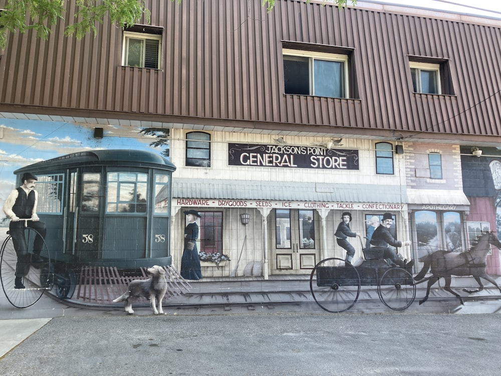 a mural on the side of a building with a horse drawn carriage