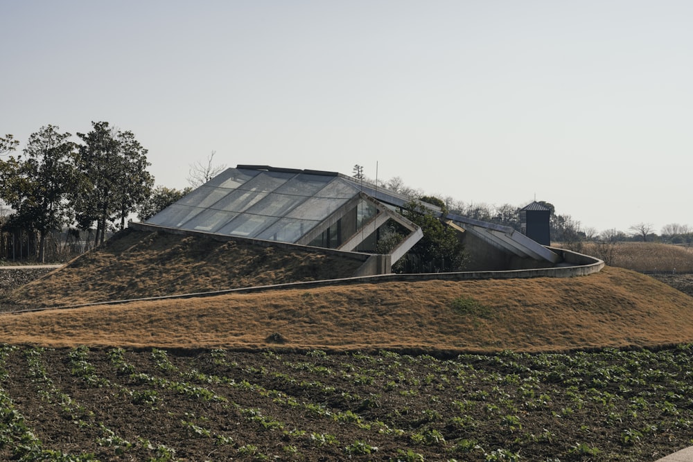 a large mound of dirt with a house on top of it