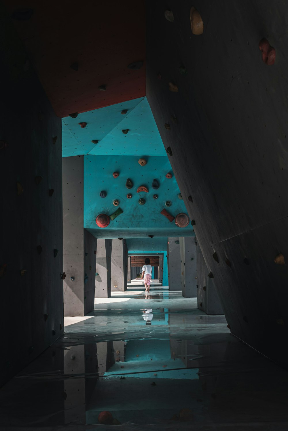 a person climbing up the side of a rock wall