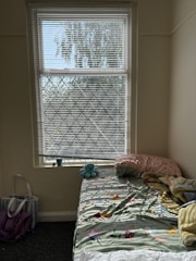 A cozy nursery corner filled with colorful baby toys and soft blankets.